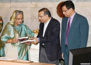 law minister in pm giving law book