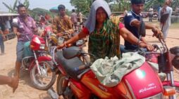 ছেলের মোটর সাইকেলের তেলের জন্য তপ্ত রোদে লাইনে মা